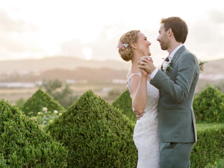 Tyler and Carlos with their wedding attire dancing at the sunset on their wedding day in Quinta do Valle do Riacho